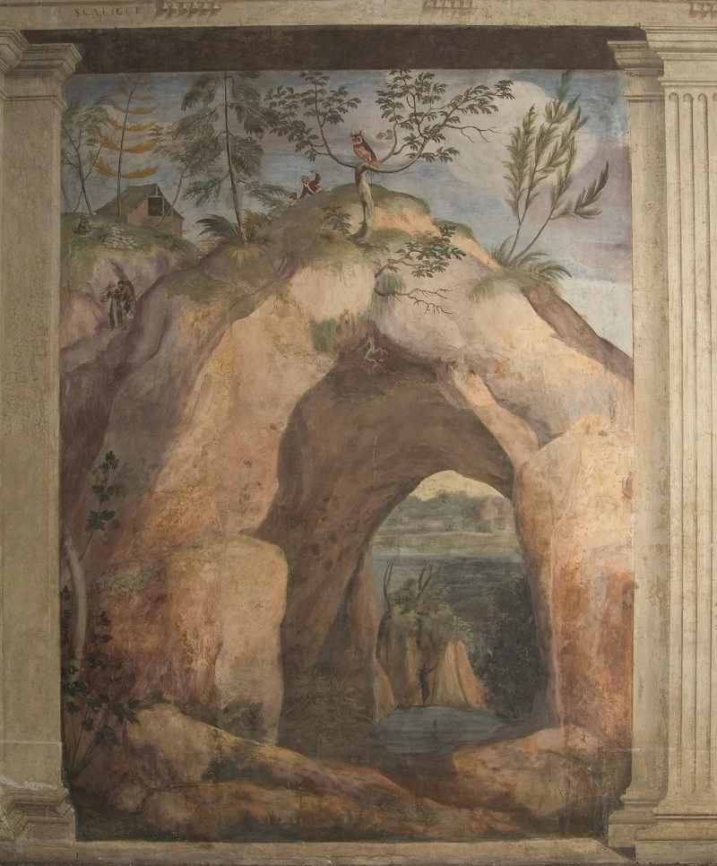 Paesaggio fluviale con grotta