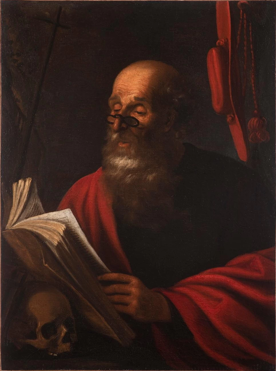 San Girolamo nel suo studio, con gli occhiali sul naso, intento a leggere un libro