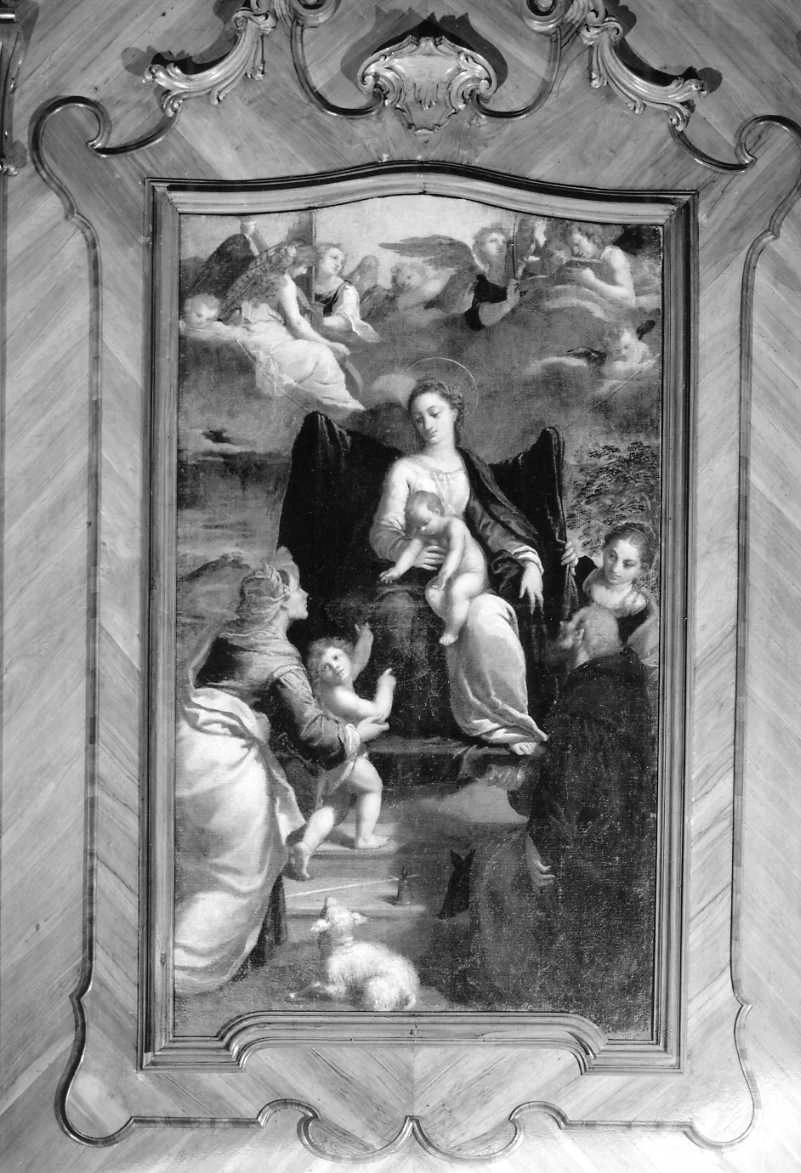 Madonna con Bambino in trono con San Giovannino, Sant'Elisabetta, Sant'Antonio Abate e Santa Lucia - Ferrara